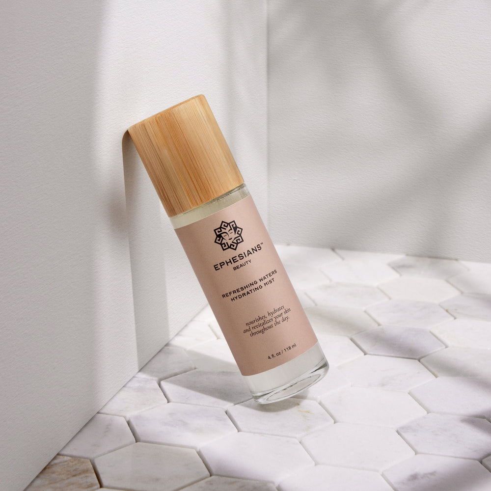 Skincare bottle with wooden cap on a light background