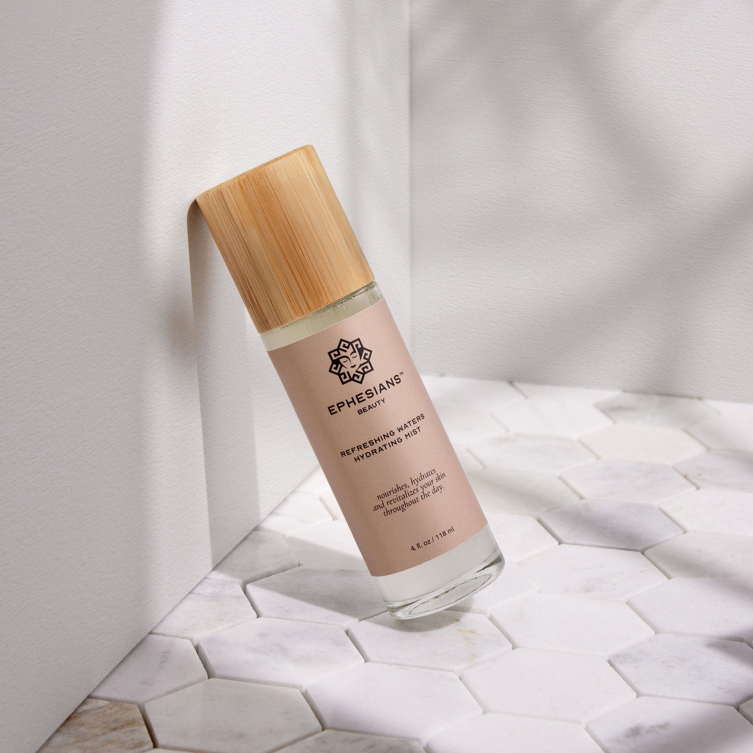 Skincare bottle with wooden cap on a light background