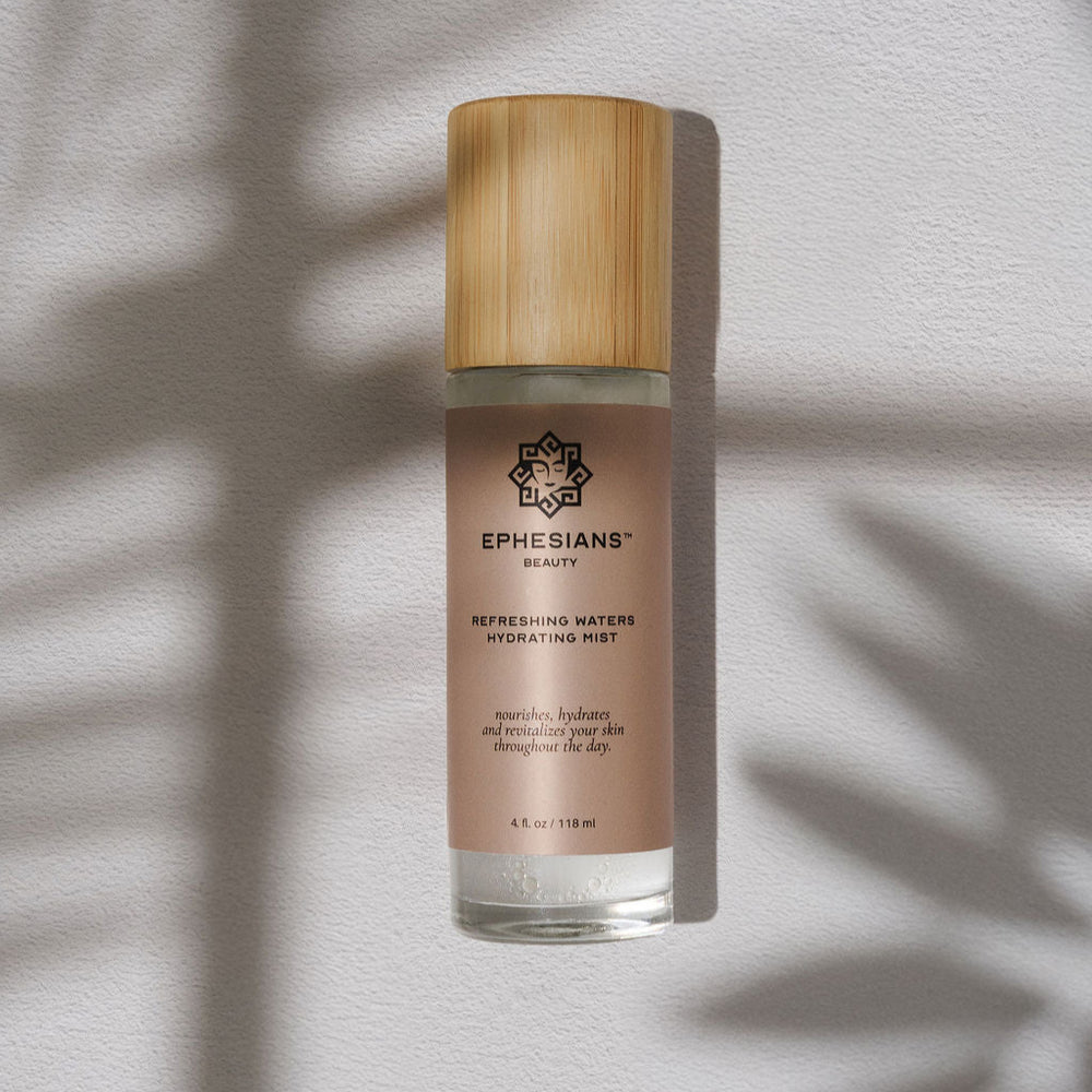 Skincare bottle with wooden cap on a light background